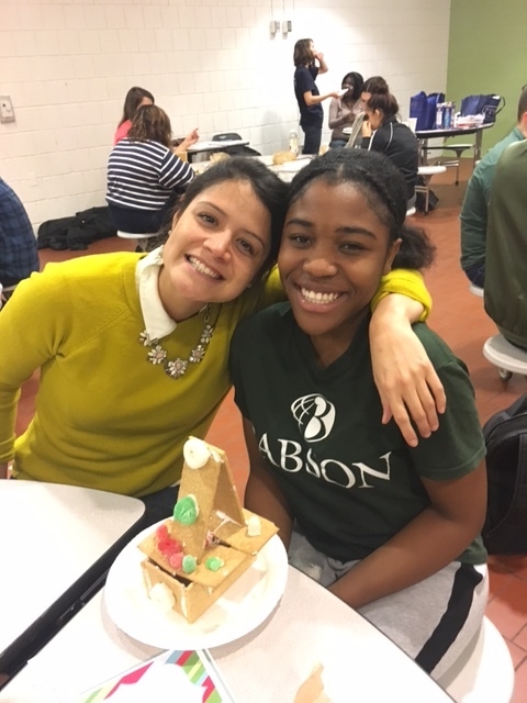 Vanessa and Wendy build a gingerbread house together.