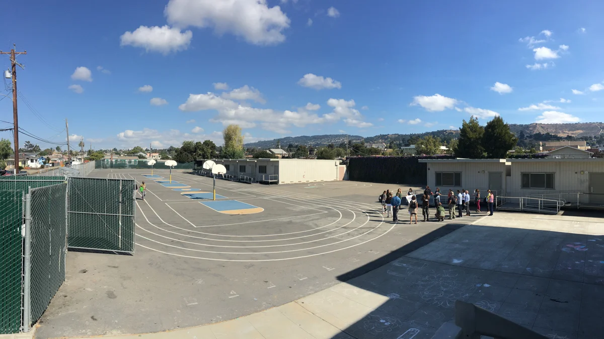 A planning session for the greening project on the paved schoolyard at Markham Elementary School. Photo © Green Schoolyards America