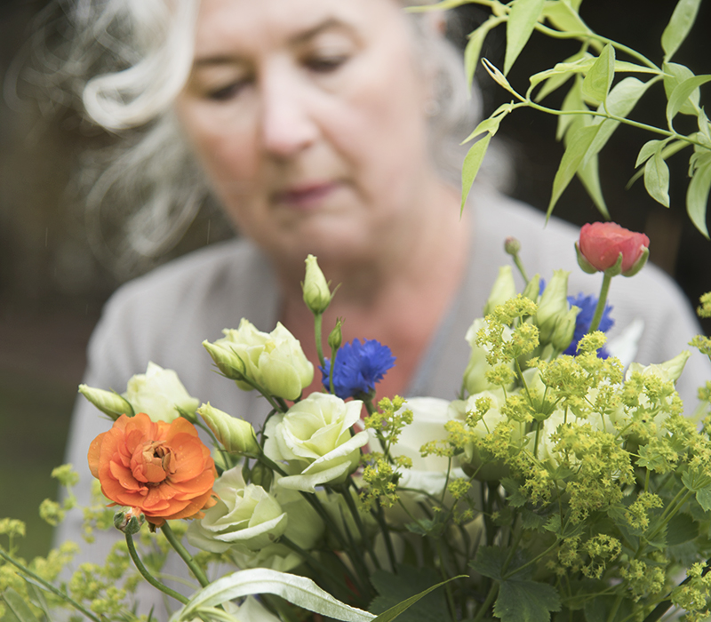 Wedding florist making bouquet