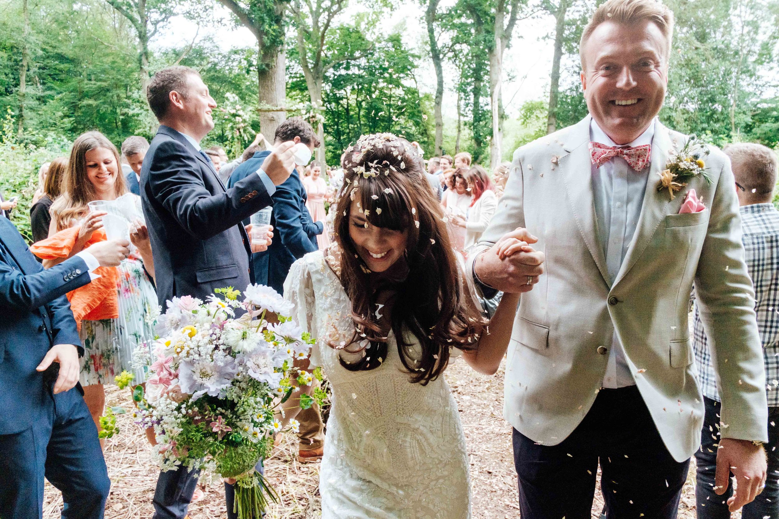Happy bride and groom in woods.jpg