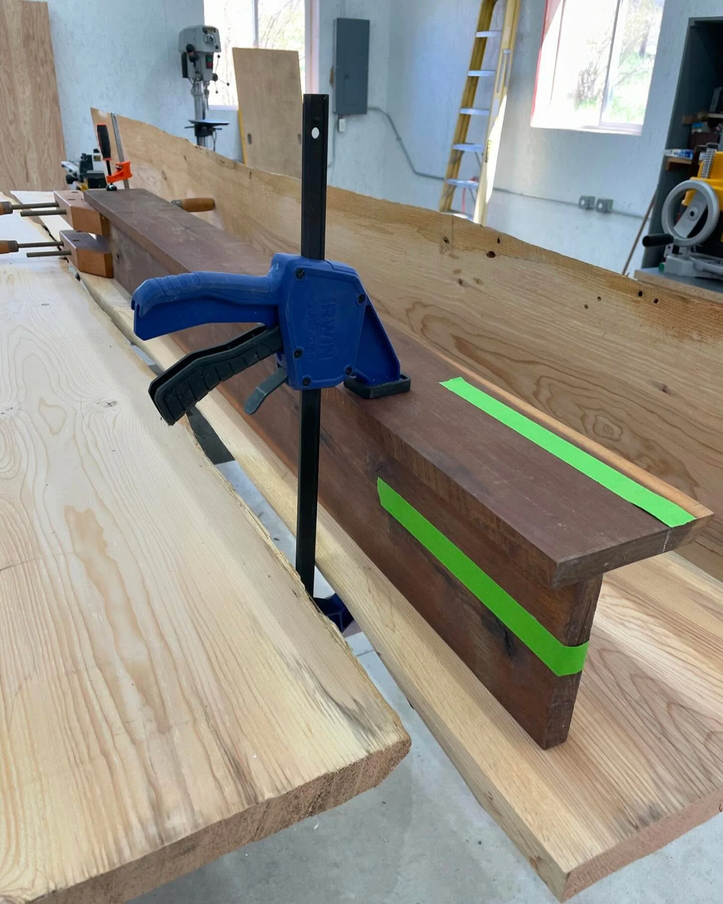 Mocking up a fireplace mantle. The high visibility tape helps imagine finished dimensions without cutting up good lumber.