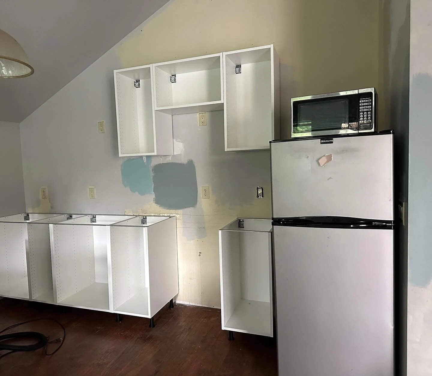 Small kitchen renovation with some really cool ledge-stone slate for a backsplash.  The floating shelves were made from the off-cuts of the countertop material.  This situation is the best case for the IKEA cabinetry: locked between two walls, so I c