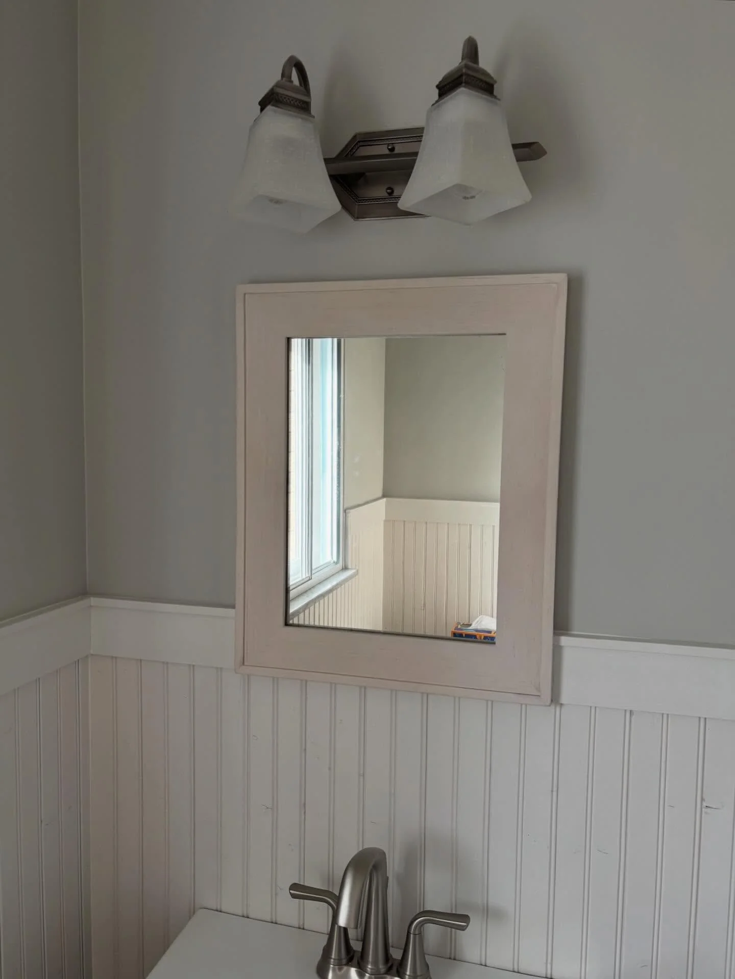 I salvaged this mirror glass from the medicine cabinet that was in our house when we bought it. It had markings on the back from 1913. When I redid my parents&rsquo; half bath, they didn&rsquo;t have a new mirror picked out, so they&rsquo;ve been wit