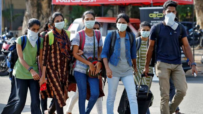 students-wearing-protective-masks-walk-outside-a-railway-station-amid-coronavirus-fears-in-Kochi-India-March-10-2020-Reuters-770x433.jpg