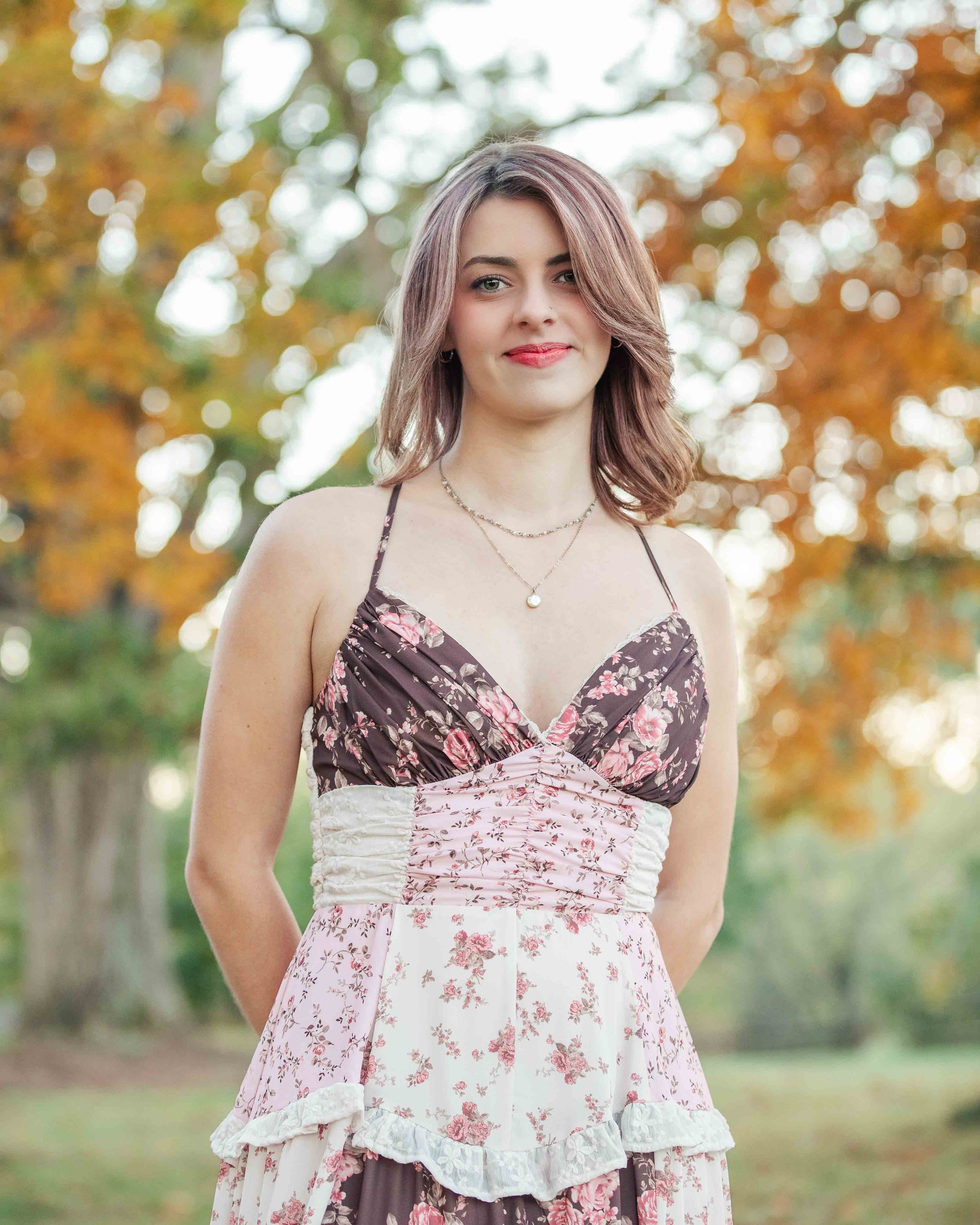 Senior girl portrait featuring fall leaves in Gambier, Ohio.