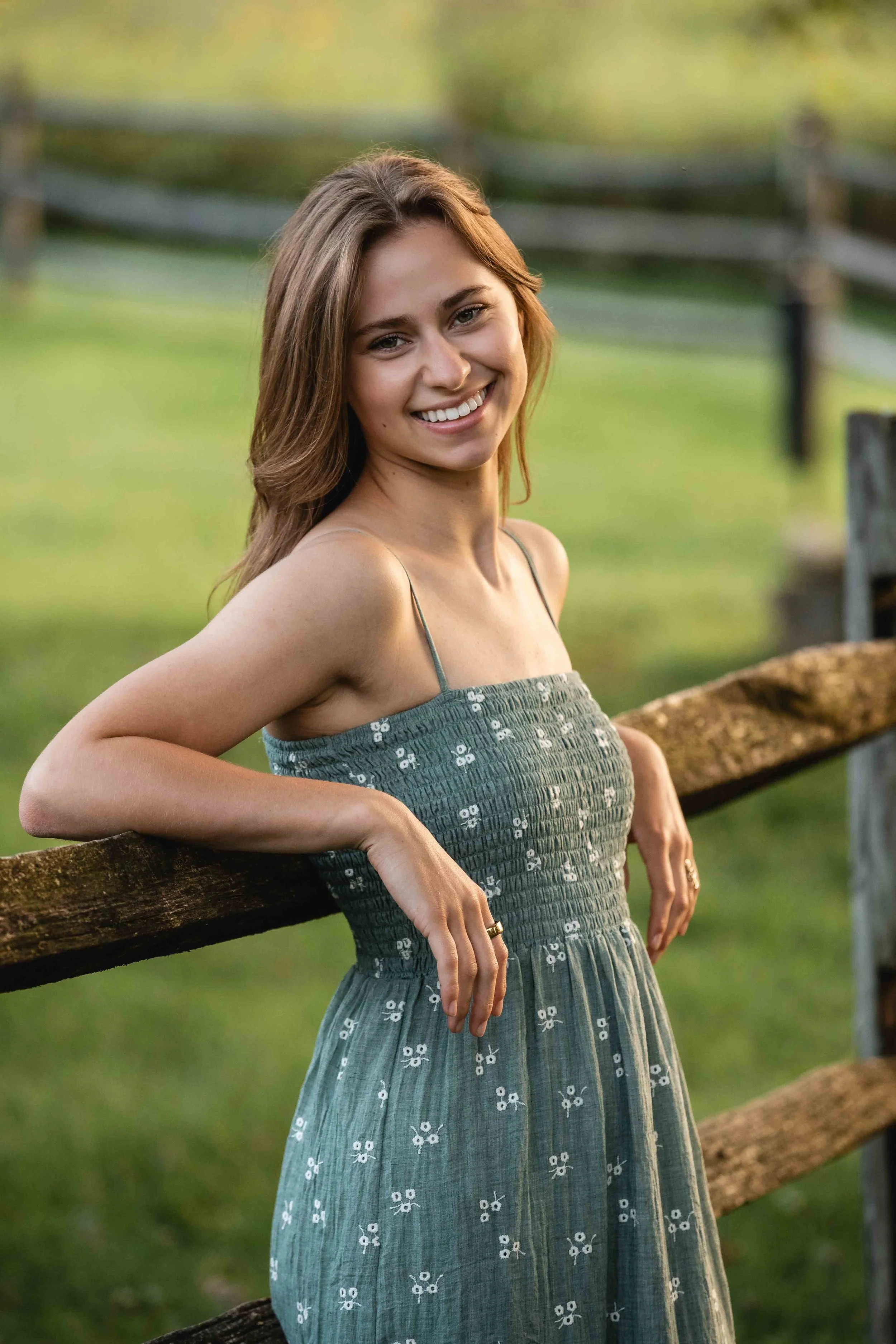 Mount Vernon high school senior leaning against a fence in Gambier, Ohio.