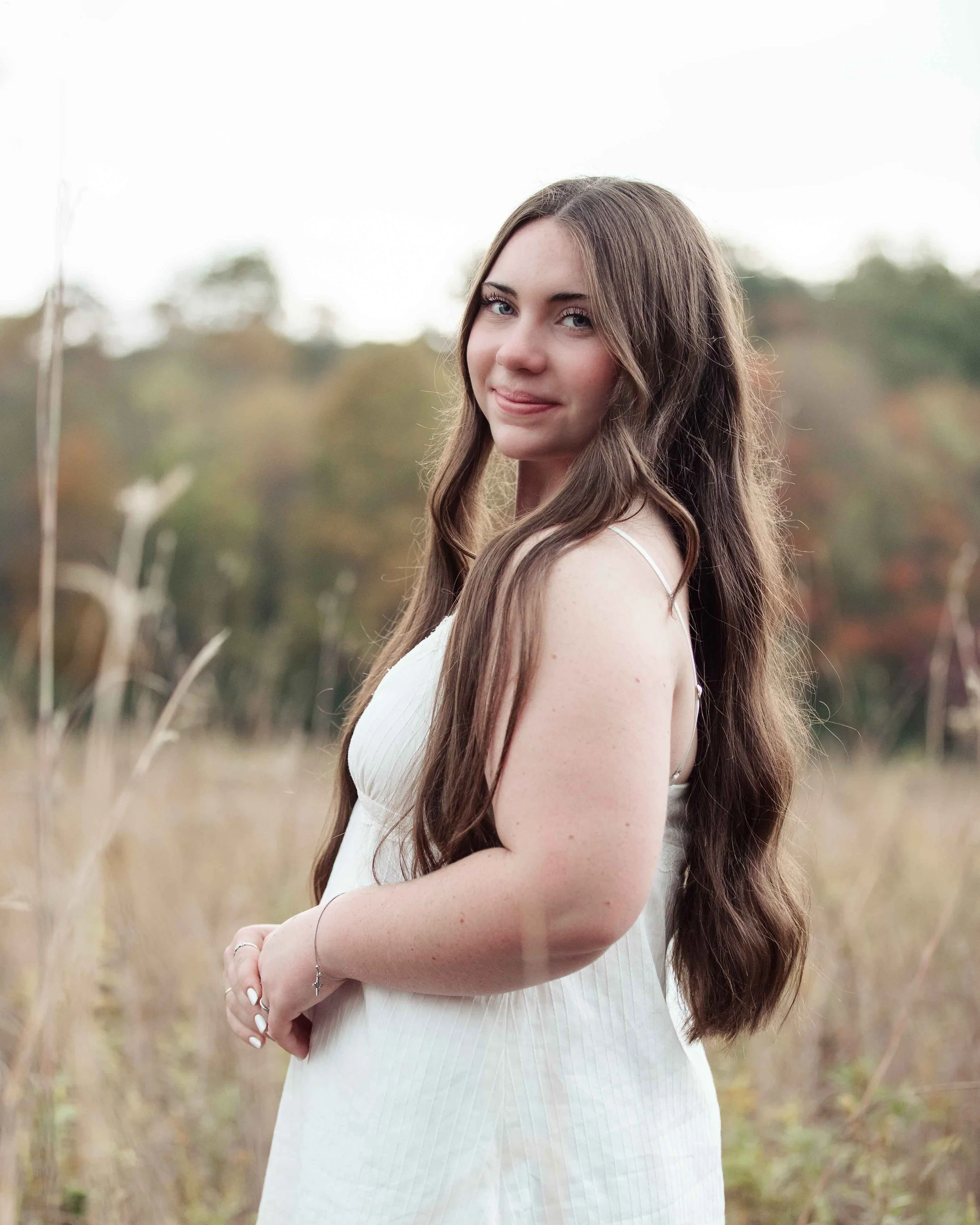 Natural Light Senior Standing in Field