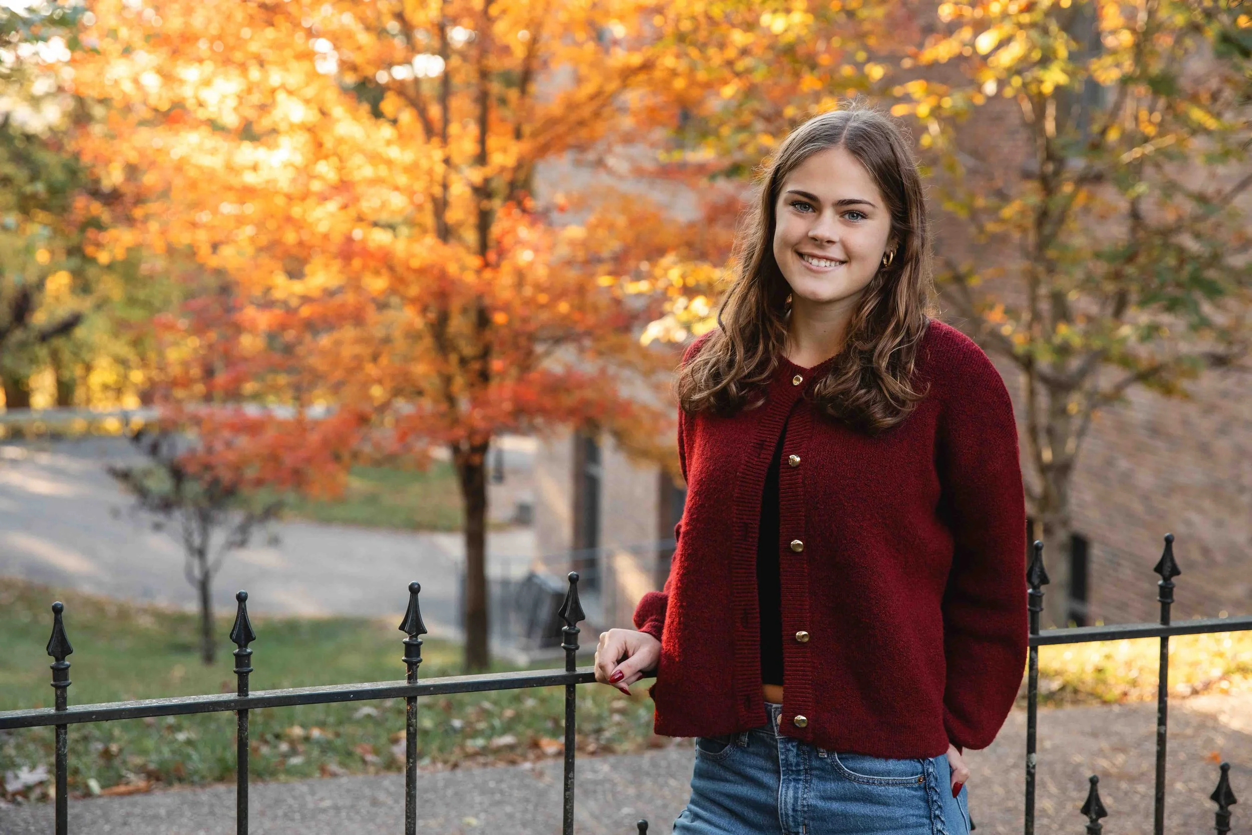 Natural Outdoor Senior Portrait with Fiery Autumn Light