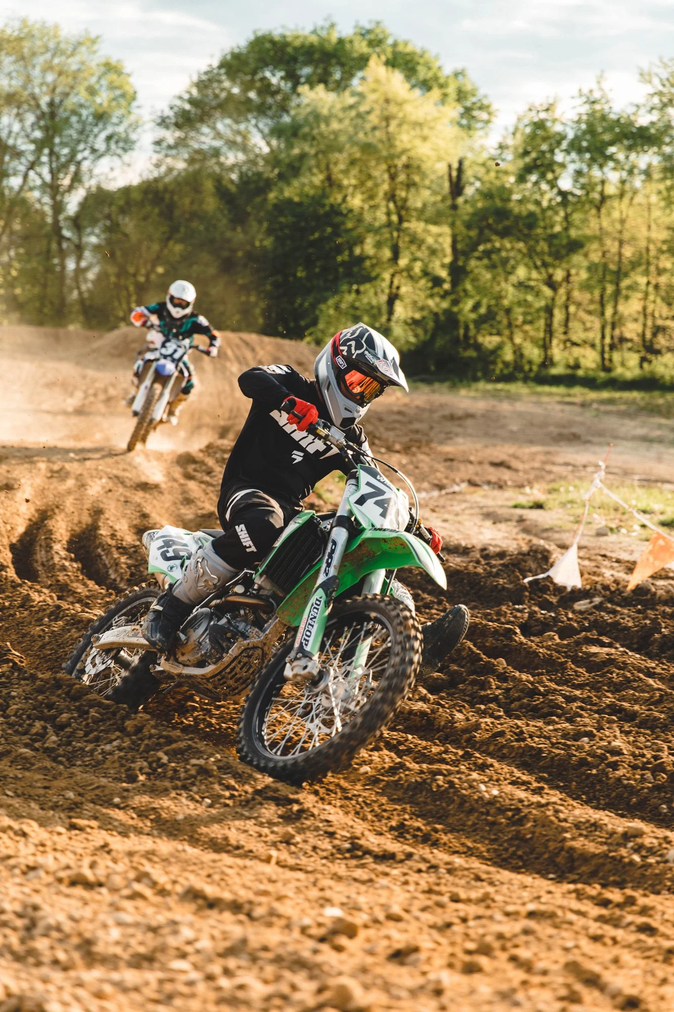 Kawasaki Rider Leading a Yamaha Rider at Route 62 MX