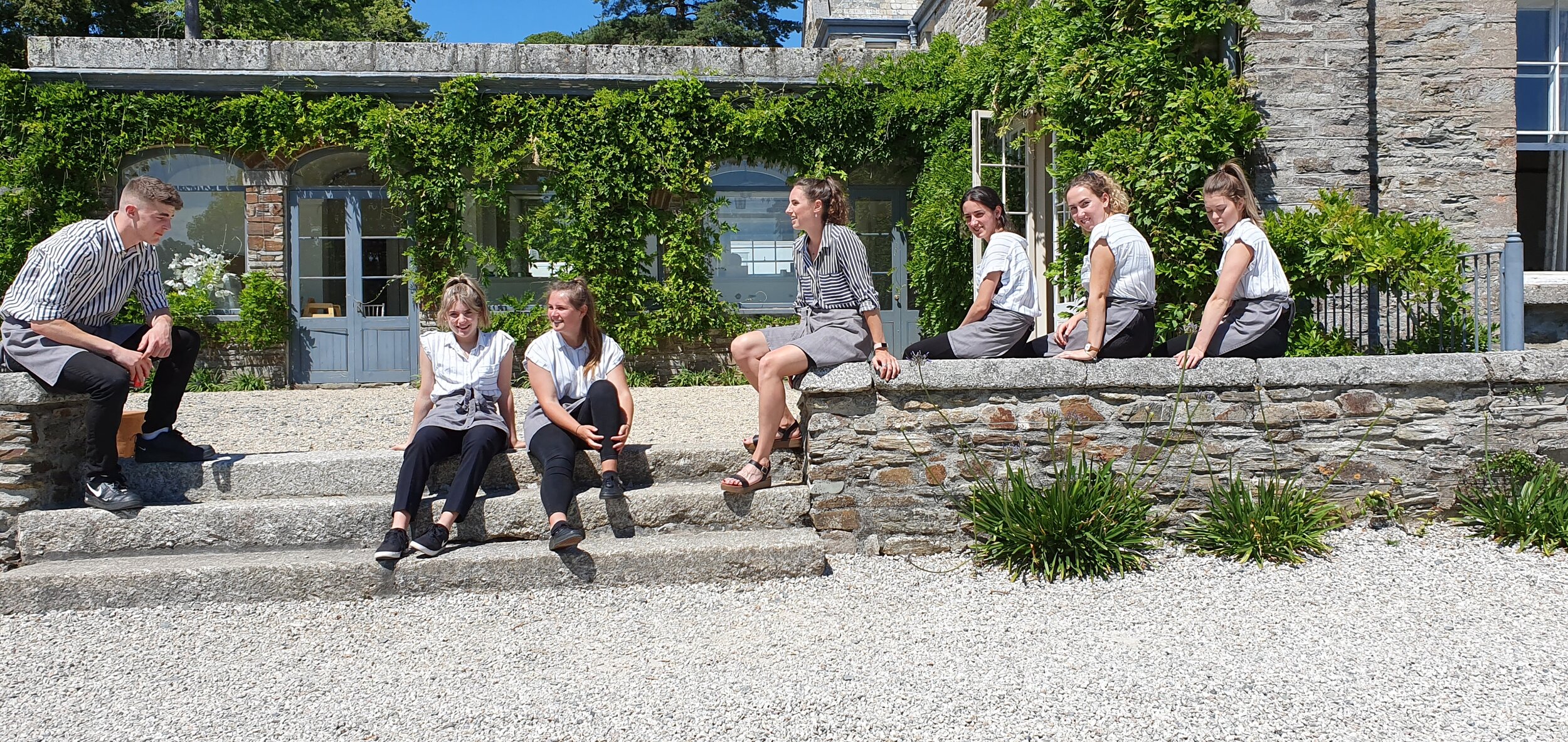  Team taking 5 whilst waiting for the arrival of the guests in the sun at the stunning Boconnoc Estate 