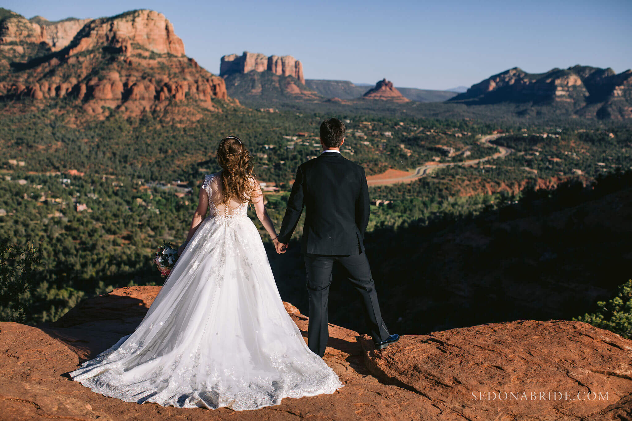 Bride and groom on red rocks of Sedona, Arizona
