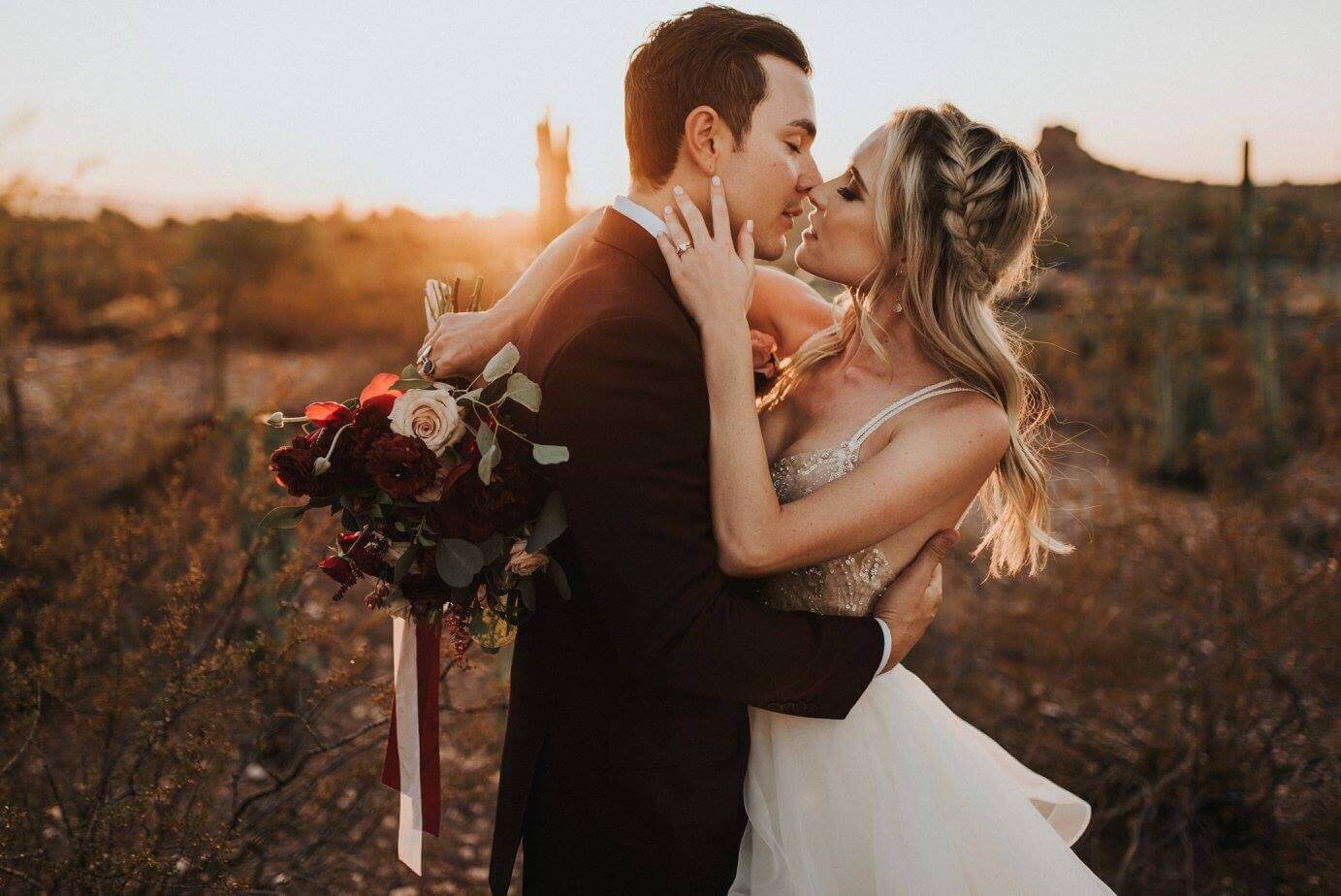 Bride and groom embrace at Desert Botanical Garden in Phoenix, AZ