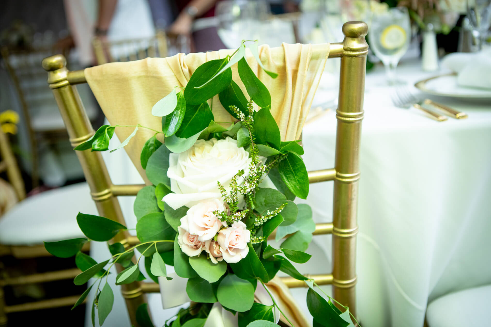 Floral chair sash at wedding reception in Gilbert, Arizona