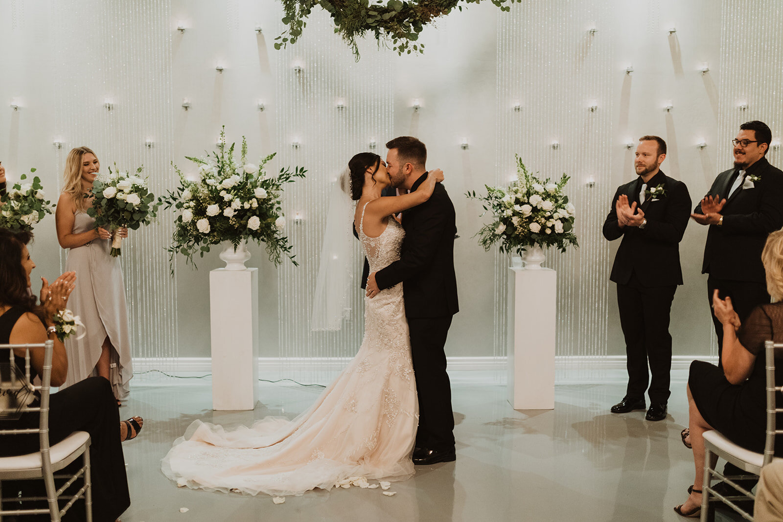 Bride and groom first kiss at SoHo63 in Chandler, Arizona