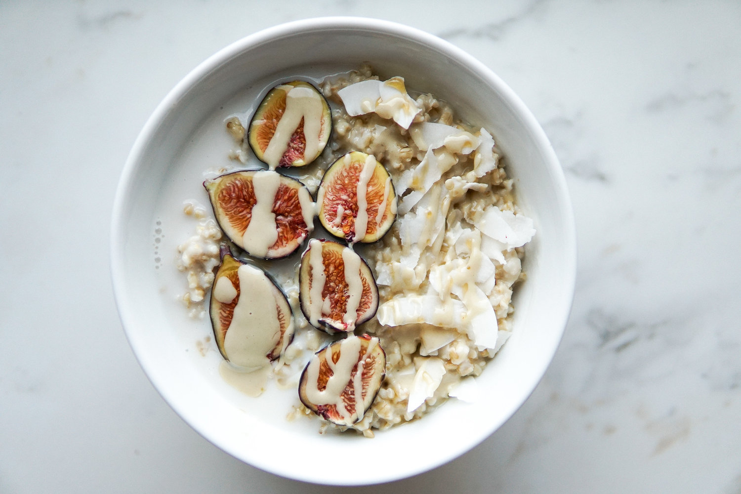 Steel cut oats with figs, coconut and tahini drizzle