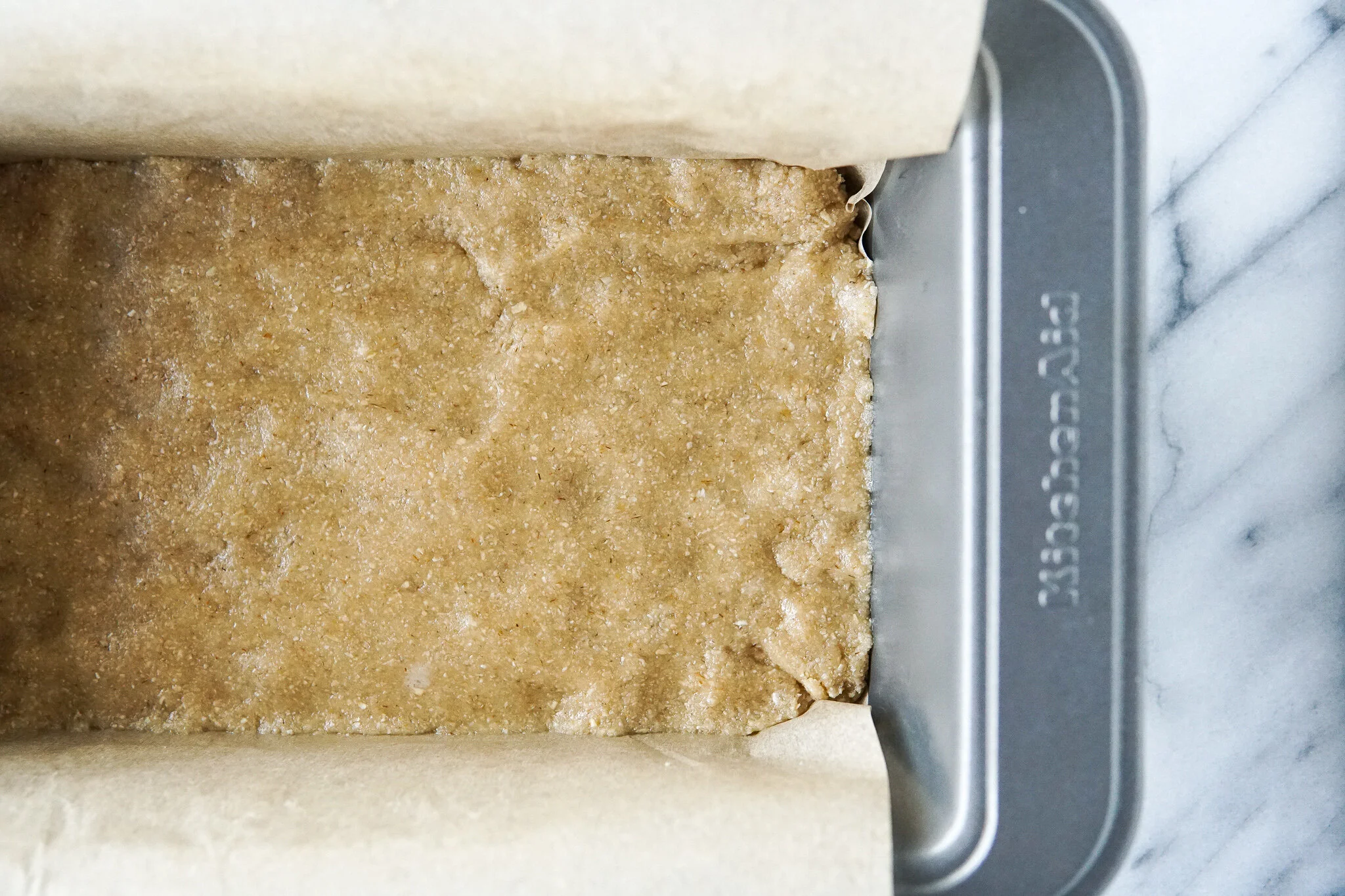 Nougat layer gets chilled in the freezer while you work on the next layer…