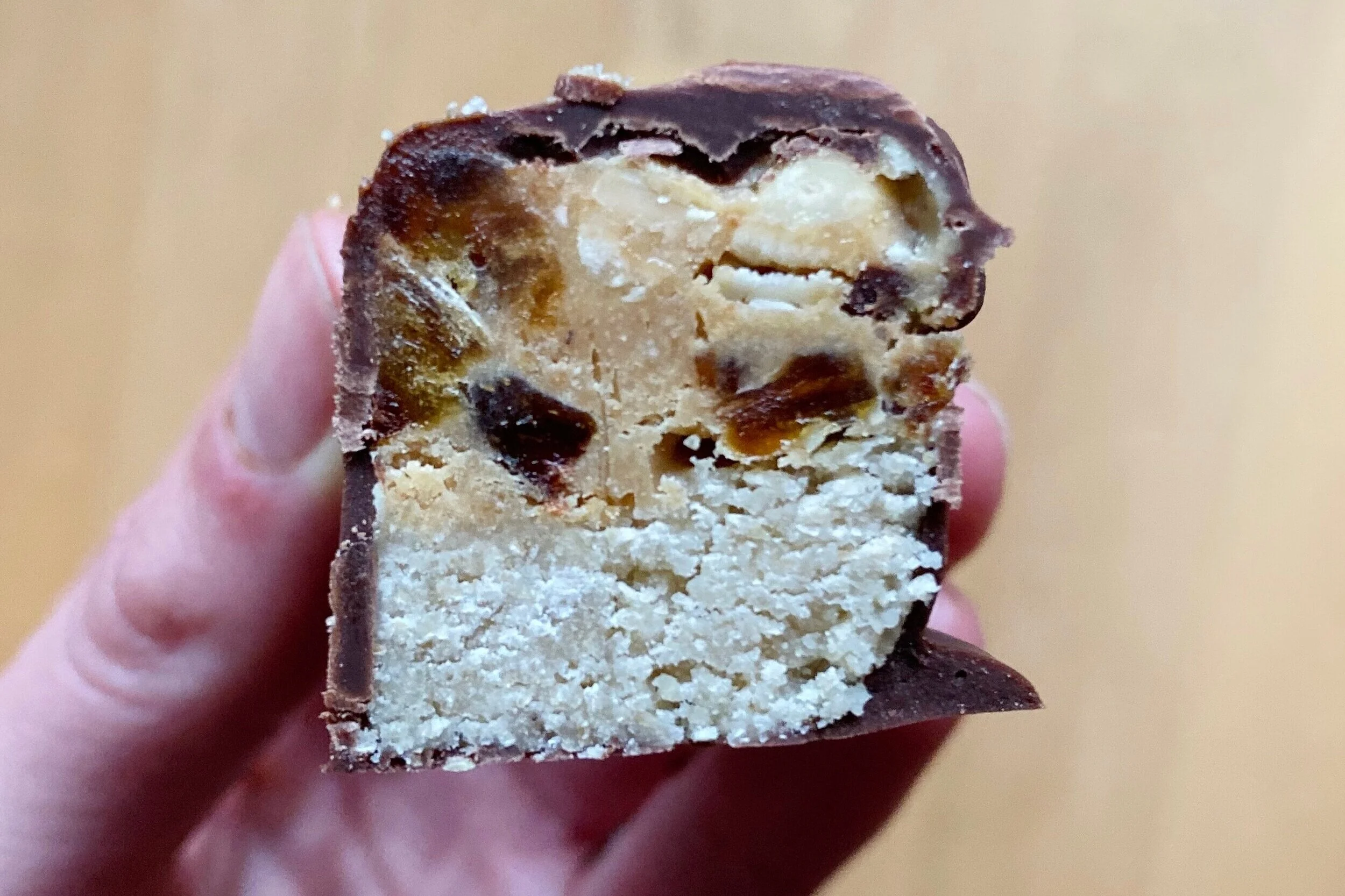 Cross section shot: bottom nougat layer, top peanut caramel with chunks of crunchy peanuts and chewy dates. Heaven!