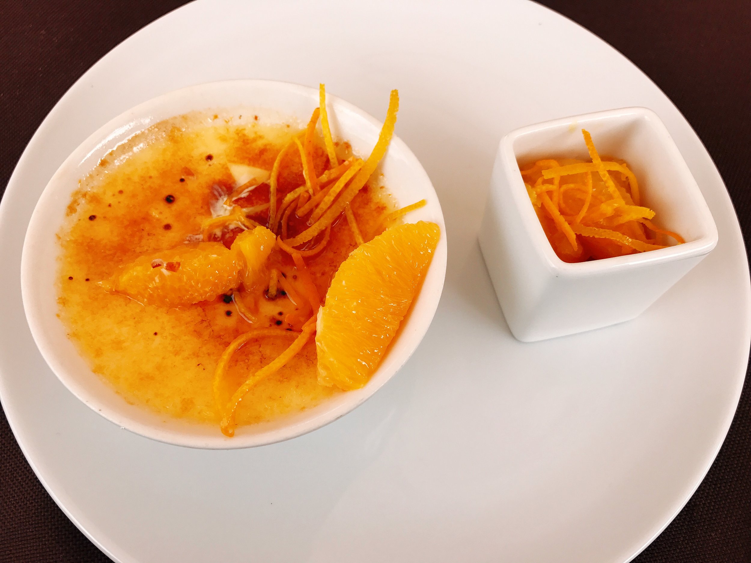 Orange and Ginger Creme Brûlée served with an Orange Compote