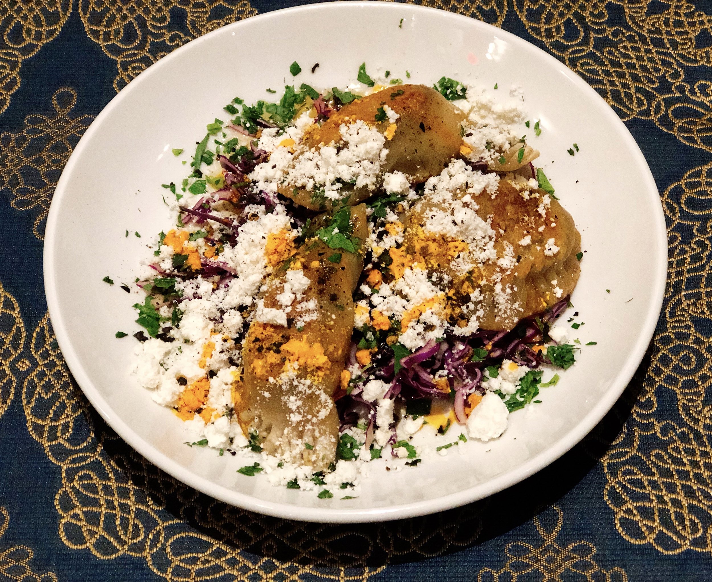 Seared Annatto Pork Dumplings | Cabbage + Brown Butter + Herbs