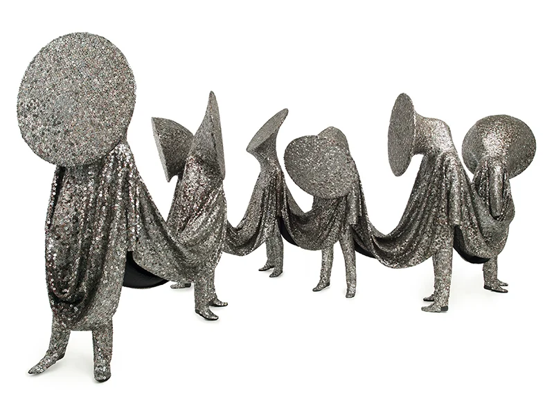 Nick Cave, Speak Louder , 2011, mixed media including black mother of pearl buttons, embroidery floss, upholstery, metal armature, and mannequins, Installed: 93 1/2 x 199 x 123 inches, Individual suits: 84 x 32 x 15 inches, 83 1/2 x 33 x 14 inches, 84 1/2 x 33 x 18 inches, 93 1/2 x 33 x 12 inches, 70 x 32 x 18 inches, 84 1/2 x 32 1/2 x 20 inches, 84 1/2 x 33 x 22 inches, Inventory #NC11.040, ©Nick Cave. Photo by James Prinz Photography. Courtesy of the artist and Jack Shainman Gallery, New York.