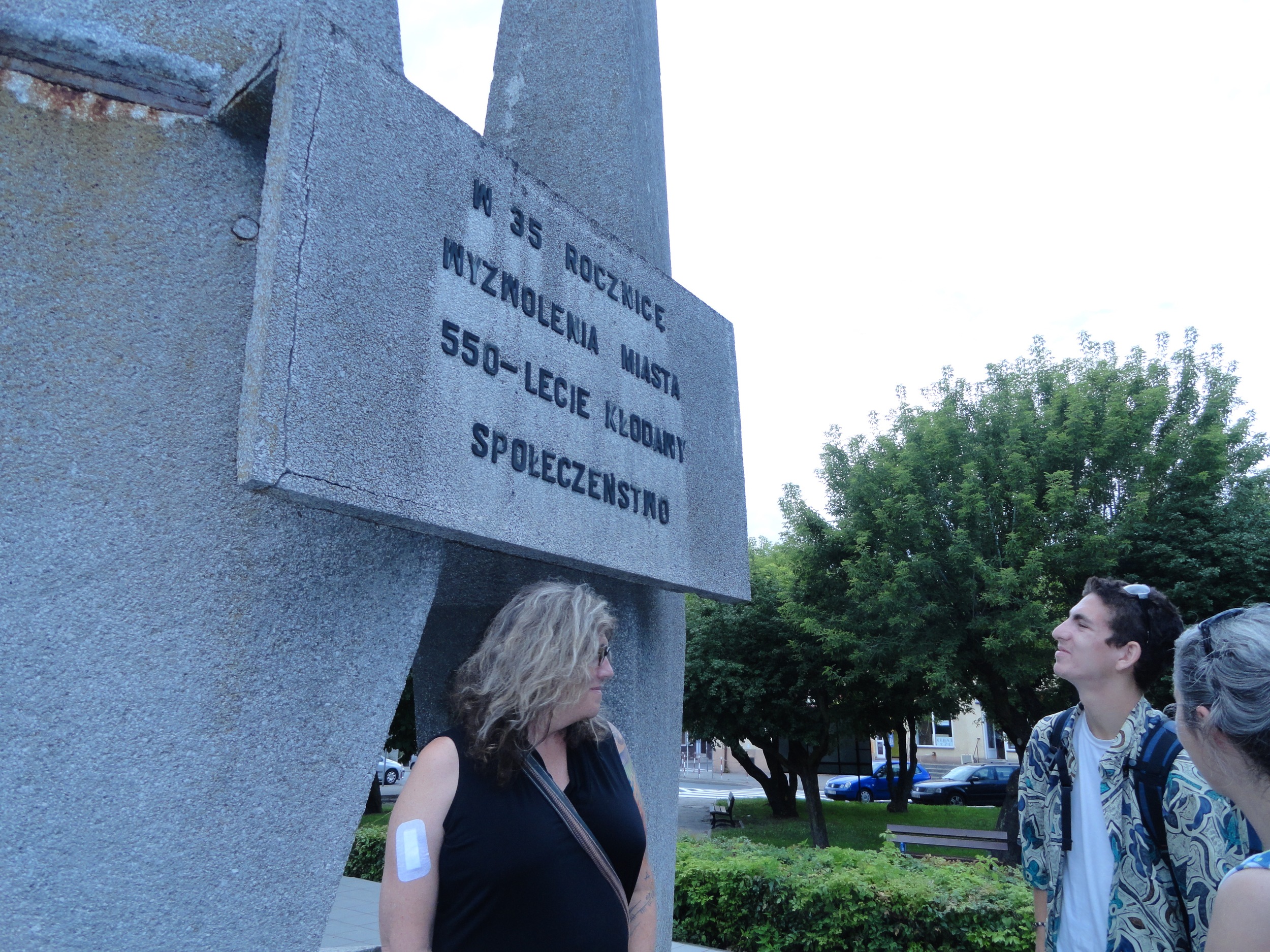 Back side of WWII memorial. Susan Stryker, Oscar Klausner and Monika Rogoska-Stangret. The text says the statue memorializes the 35th anniversary of WWII and the 550th anniversary of the founding of the town!
