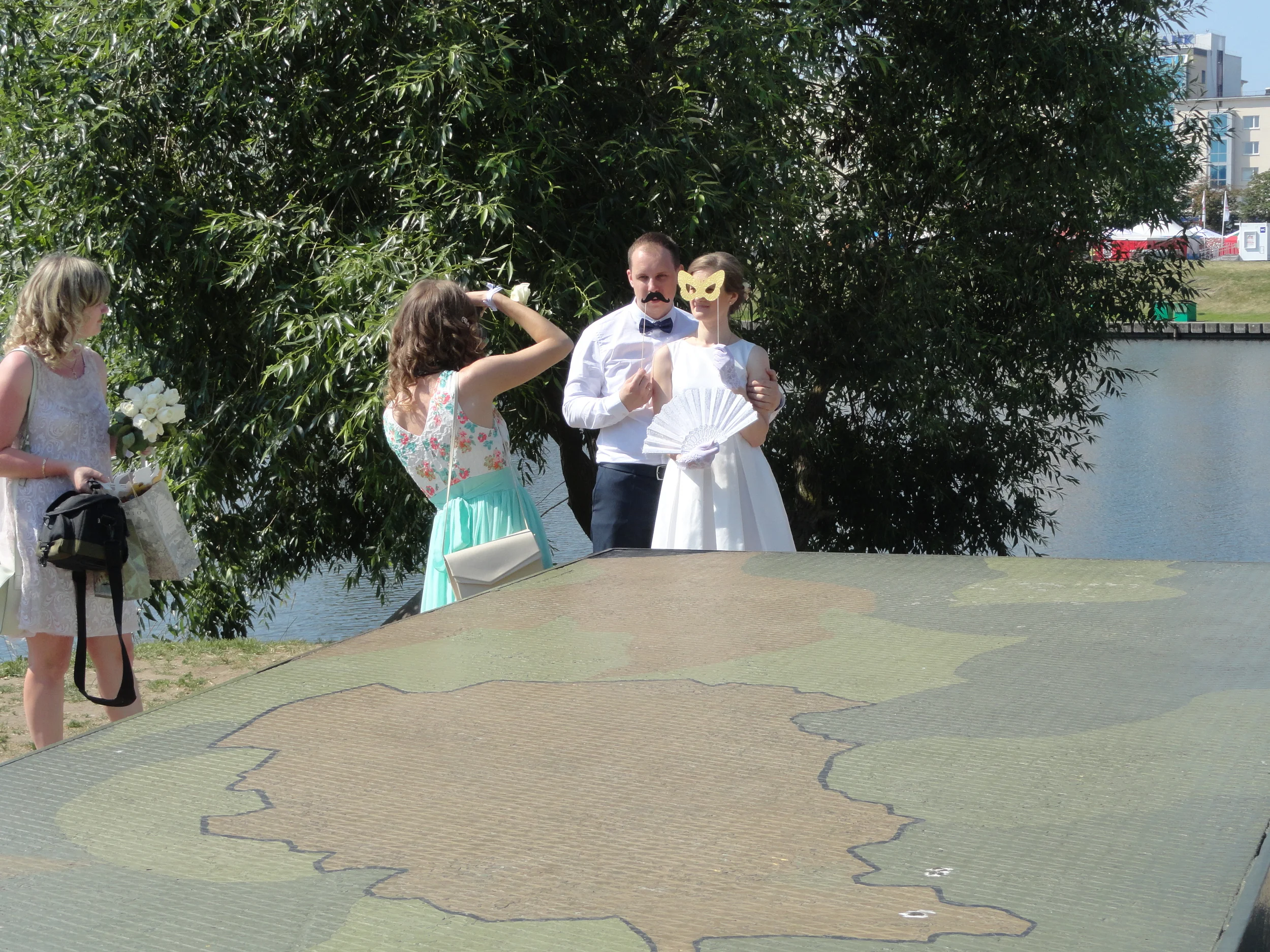 Part of a landing strip was incorporated into the memorial. (Don't ask me why the wedding party is posing with those masks!)
