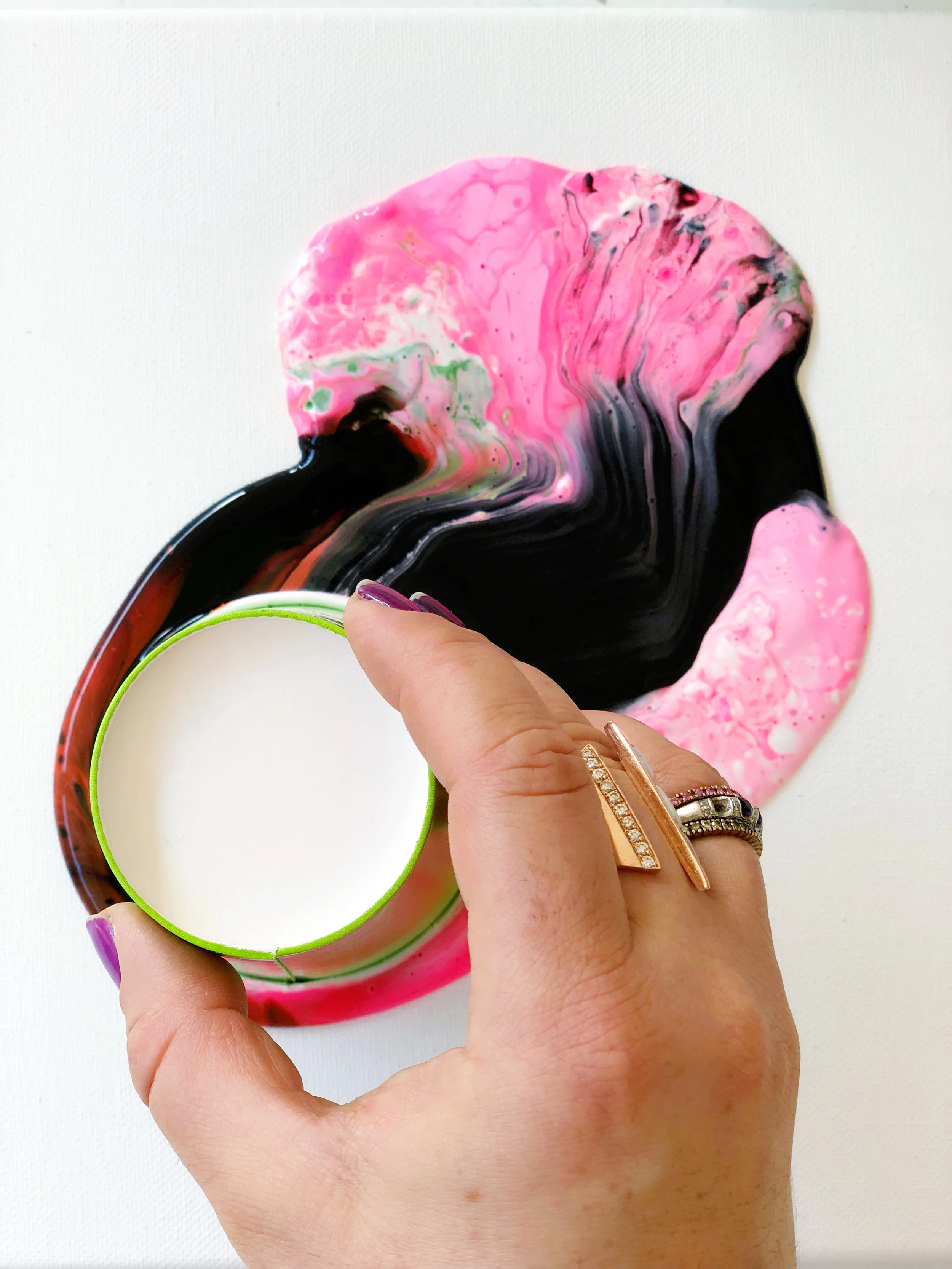 12. You can now begin to move the cup around the painting surface. lifting and dragging