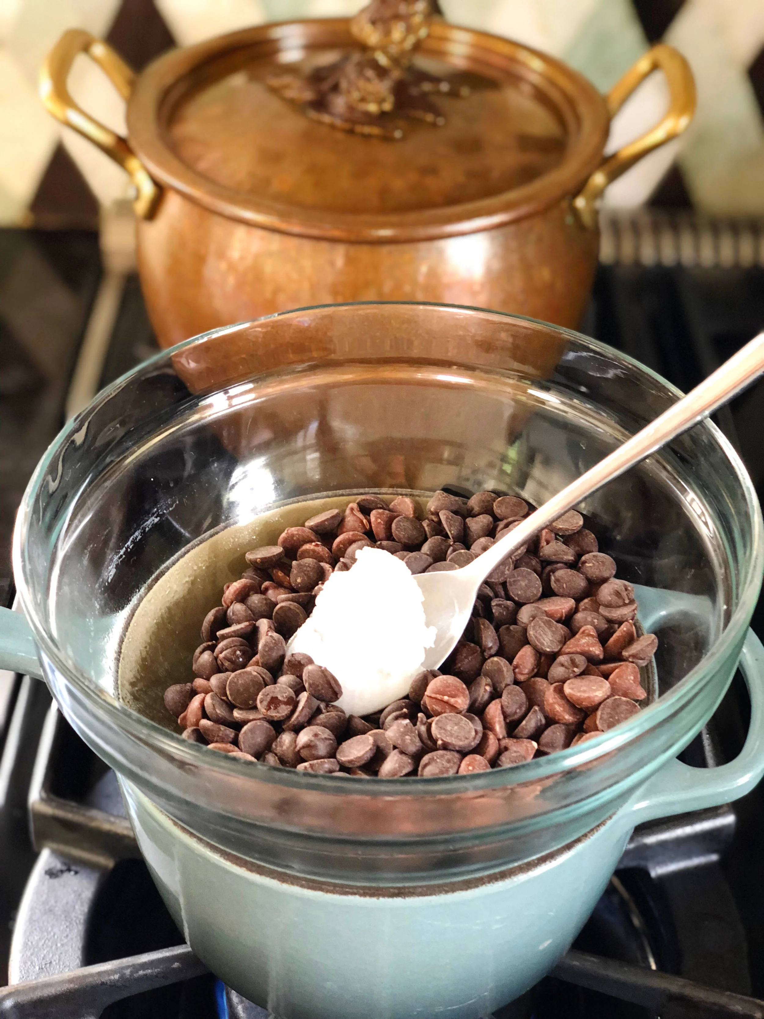 2. Place all the chocolate chips and coconut oil into a glass bowl.