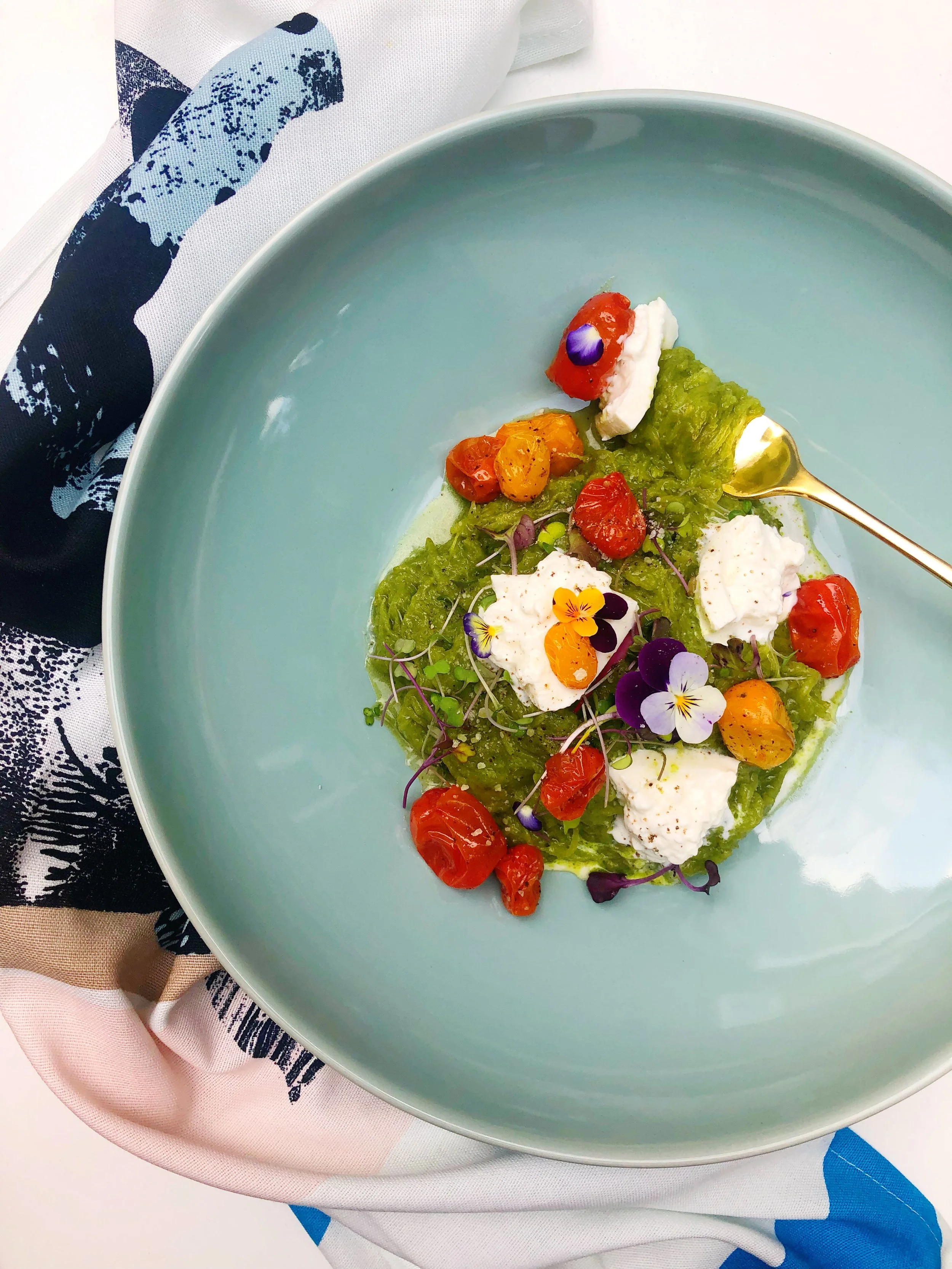 PESTO SPAGHETTI SQUASH WITH BLISTERED CHERRY TOMATOES AND BURRATA