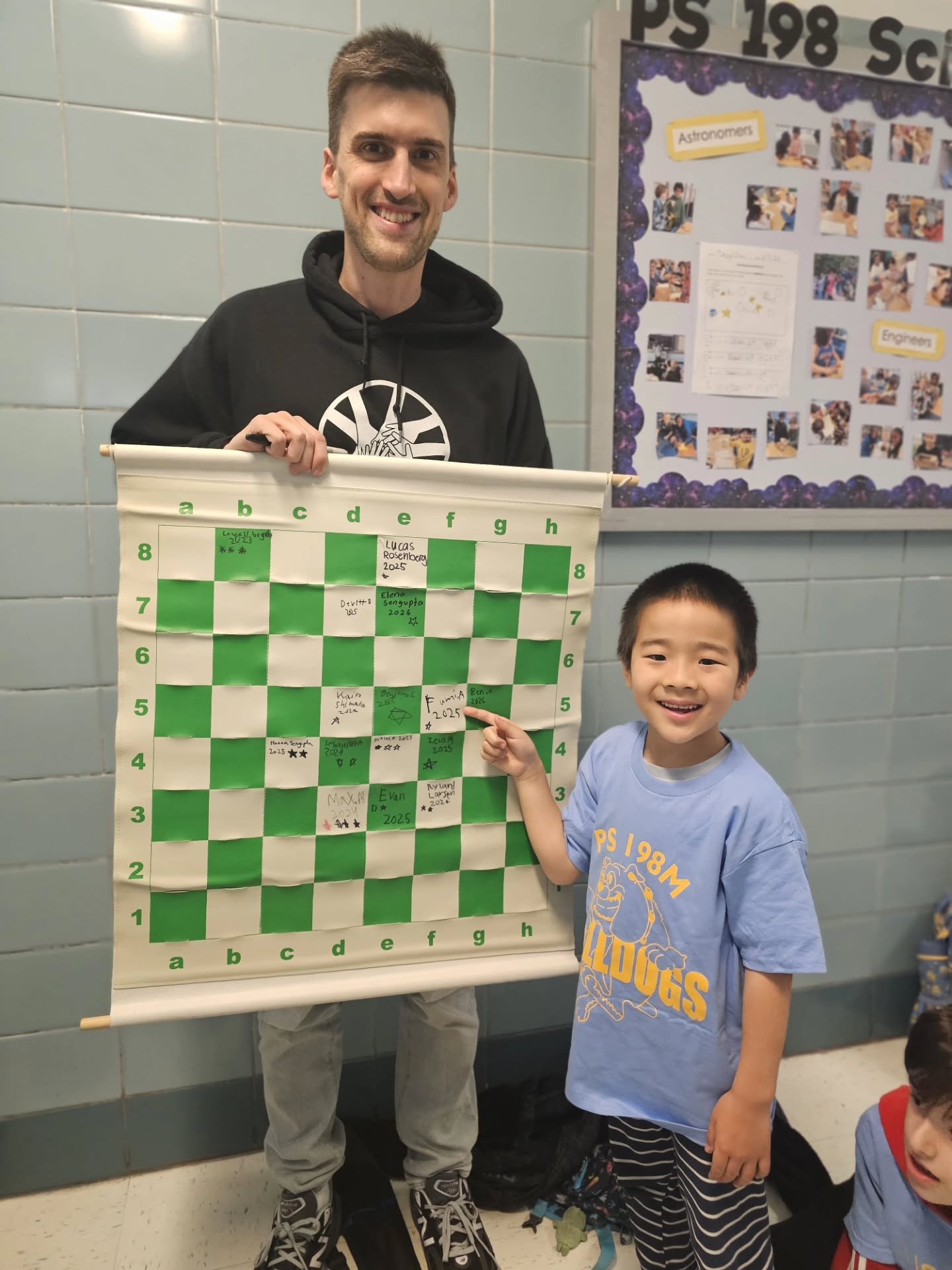 Congrats to Fumi (1st grade) and Evan (3rd) for becoming the most recent PS 198 Bulldogs to break 1200 USCF rating. 

PS 198 won 3rd Grade Nationals in Spokane this past December. This weekend 23 Bulldogs will be competing in Baltimore, with full tea