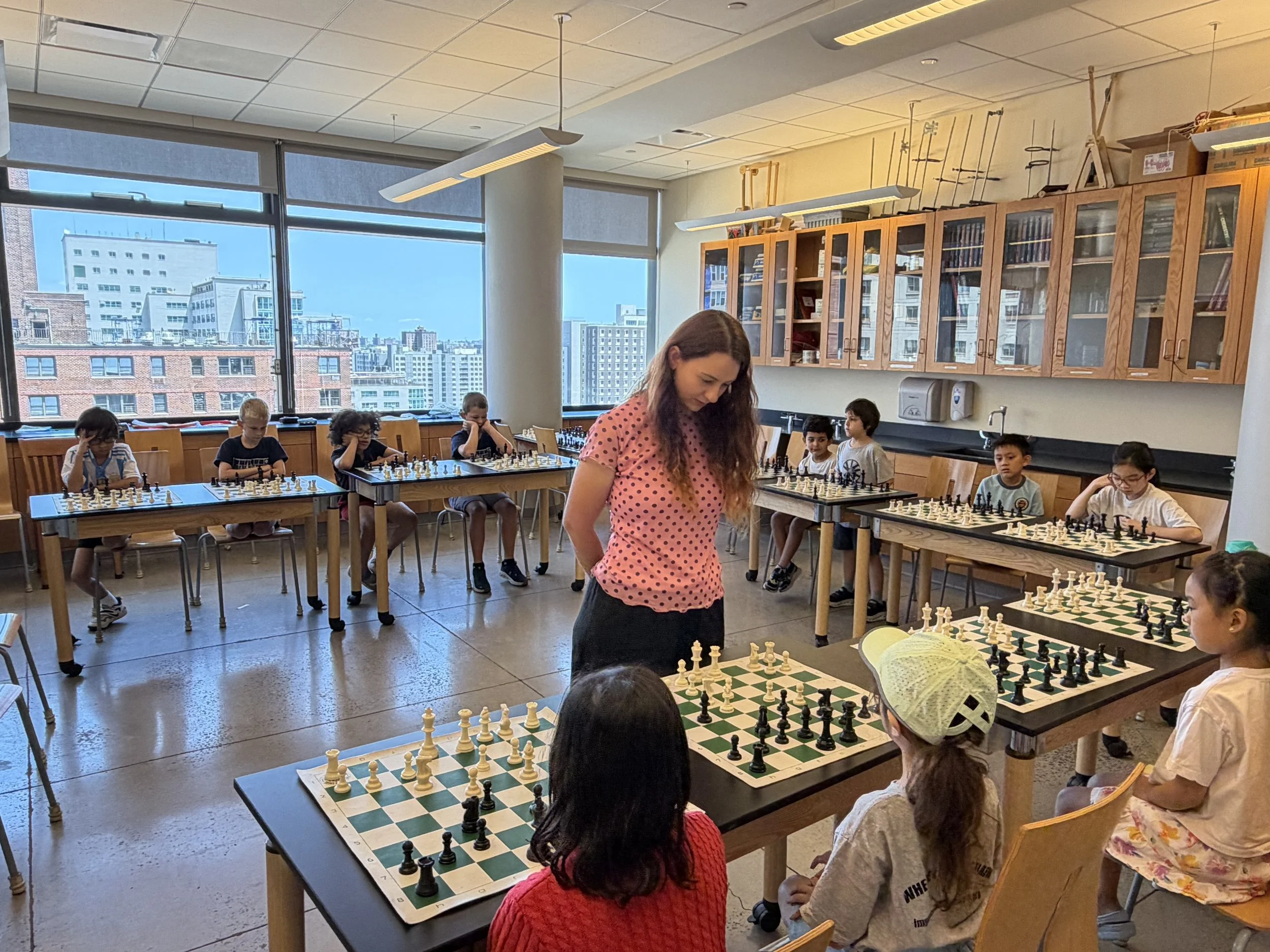 WFM Maria Manelidou Lectures and Plays Against UES Chess Camp