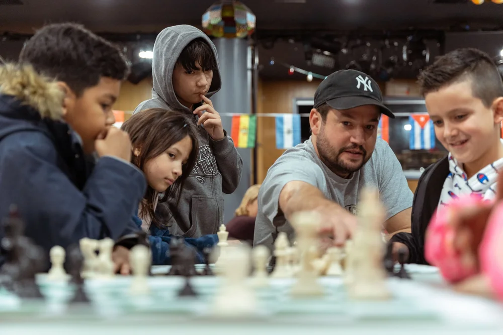 Refugees Square Times Square Refugee Chess Center — Impact Coaching Network