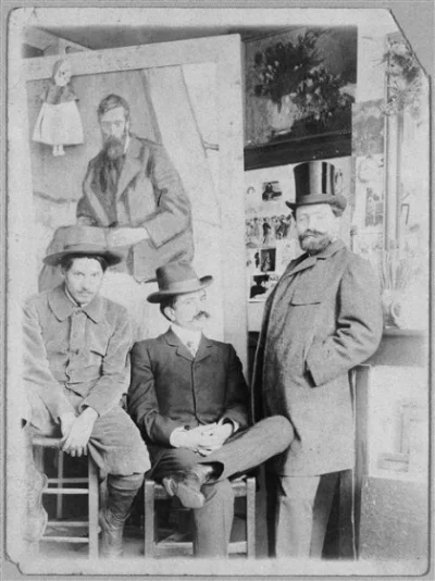 Pablo Picasso (left) with friend Torrès Fuentès and dealer Pedro Mañach in Picasso's studio, Paris, 1901. © RMN - Musée Picasso Paris