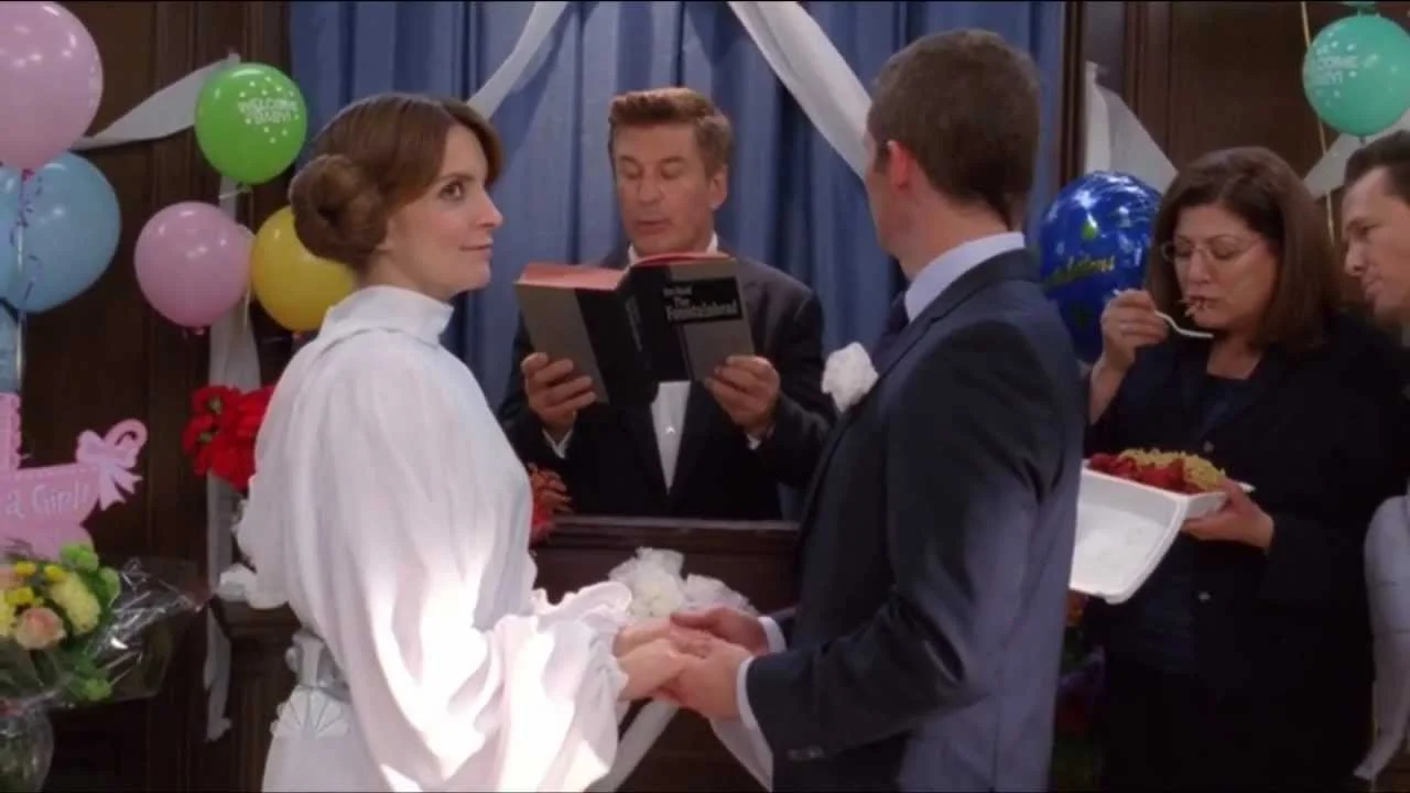 I couldn't find screencaps from the episode where Liz Lemon is in three weddings in the same day, so have this picture of Liz Lemon's wedding instead.