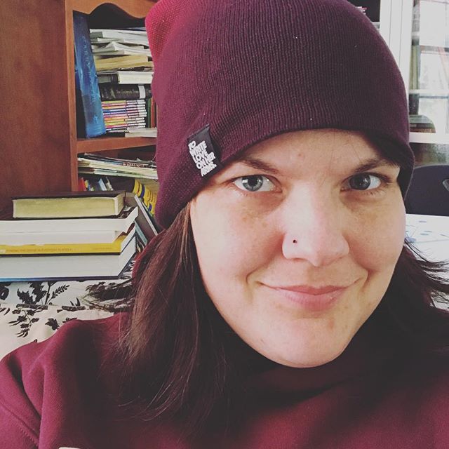 I wear winter hats inside, because they&rsquo;re cozy. #amwriting #towriteloveonherarms #givingtuesday @twloha (Also, the yellow spined book behind me? It&rsquo;s @kaitlincurtice&rsquo;s Glory Happening. Buy it, y&rsquo;all.)