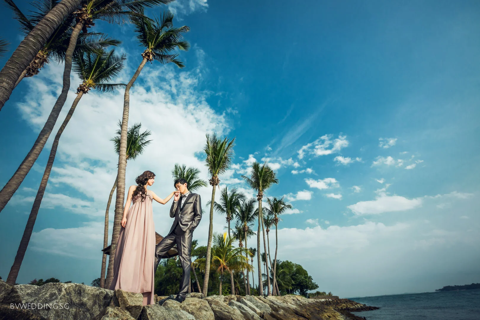  As the yellow yolk of the sun descend down behind the horizon where the sky meets the ocean, the sandy beaches are slowly tinted in amber hue; an amazing place to take romantic pre-wedding photos. 