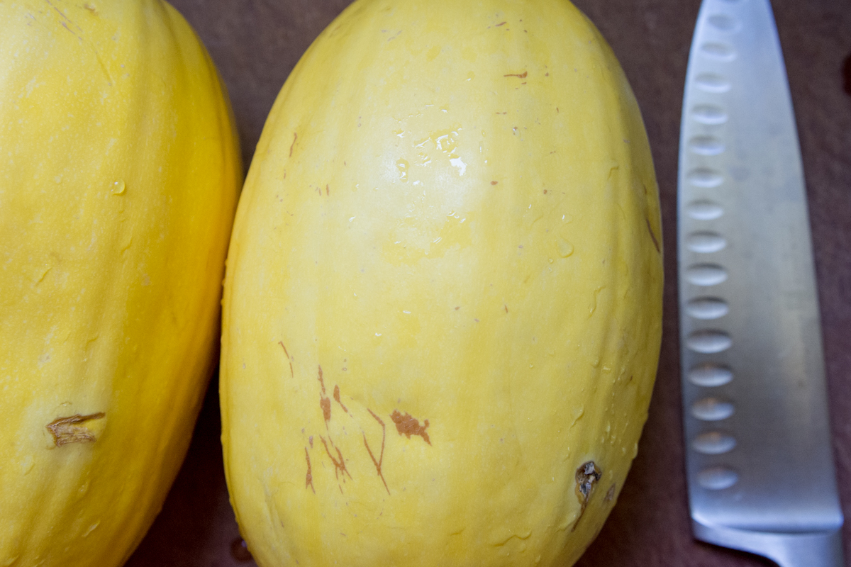 Wash and (carefully!) cut the squash in half.