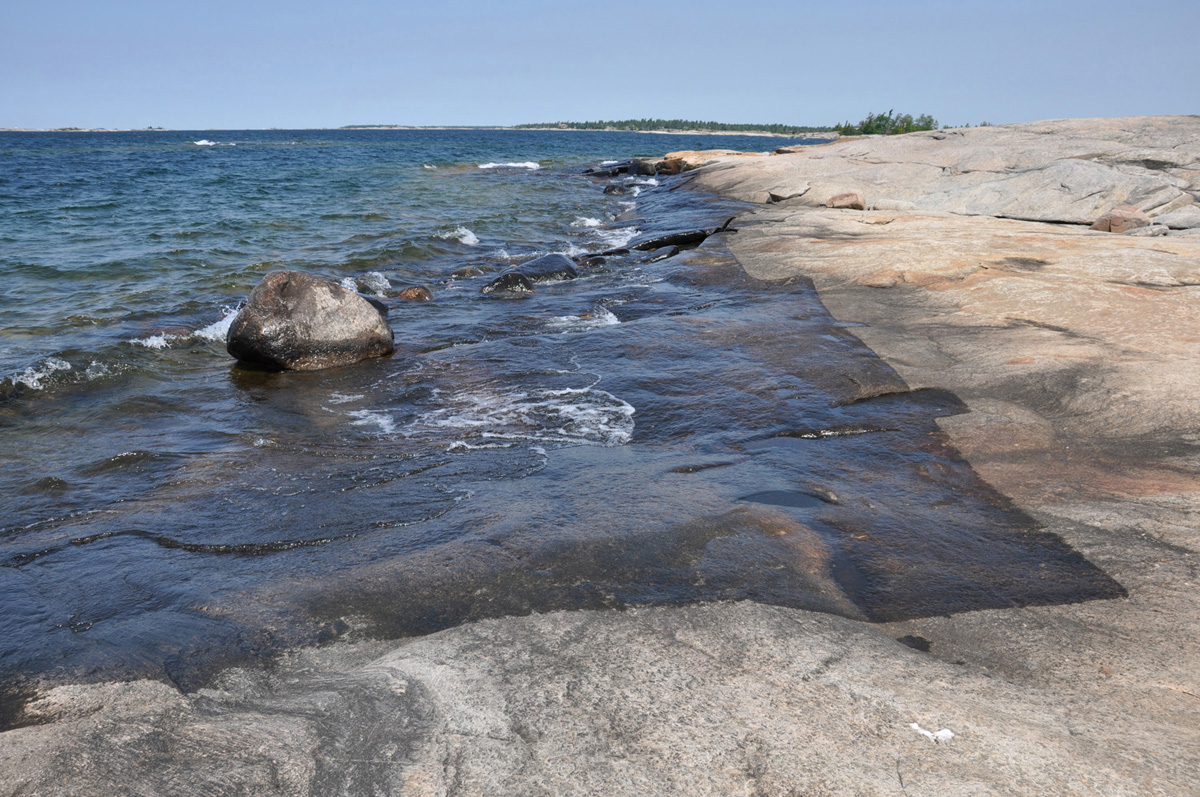 Water Drawings, Clearcut, 2012, medium: water, sun, rock, land art/performance/action art, documented as a digital print, 41 x 56 inches, (Photo by: Toni Hafkensheid)