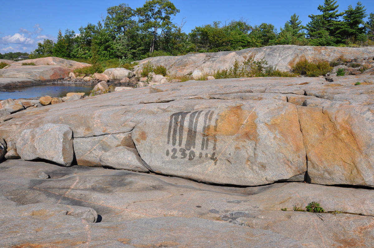 Water Drawings, Barcode, 2012, medium: water, sun, rock, land art/performance/action art, documented as a digital print, 41 x 56 inches, (Photo by: Toni Hafkensheid)