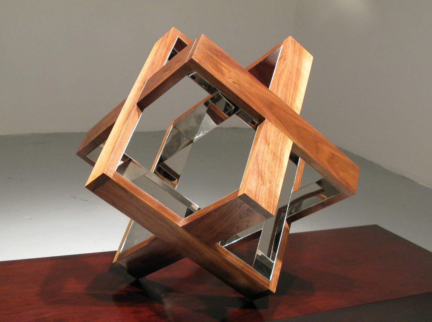 Strip Cube (Walnut), 2009, walnut, mirrored stainless steel, 18 x 18 x 18 inches