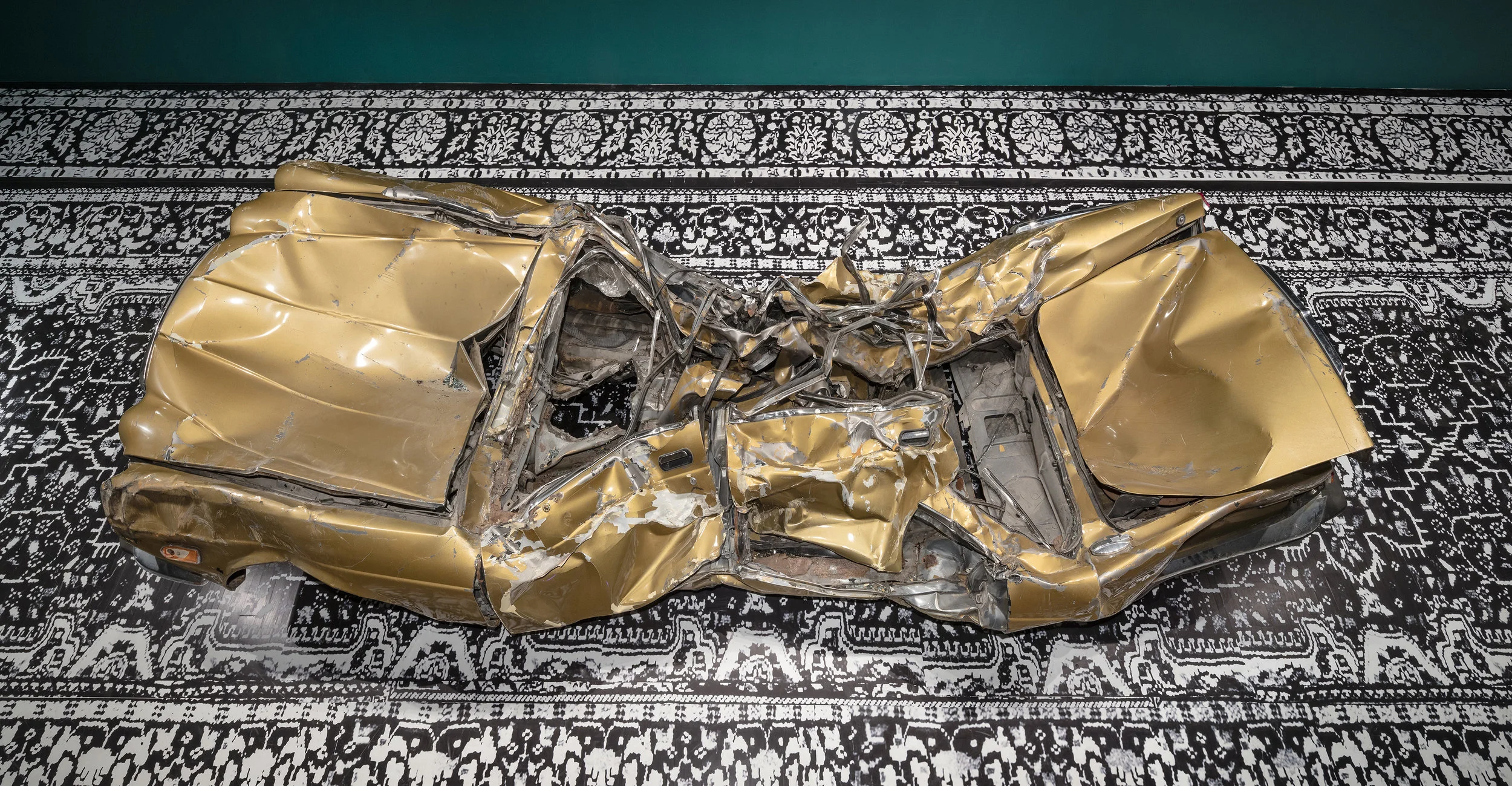 I am the American Dream (still just a Paki)/Seminar Series on Race, Destruction and the many afterlives of a Paki: A private talk for one by your less than Ideal Representative , 2010/17, 1987 gold Jaguar Vanden Plas, installation view at the Art Museum at the University of Toronto as part of the 2017 Sobey Art Award exhibition