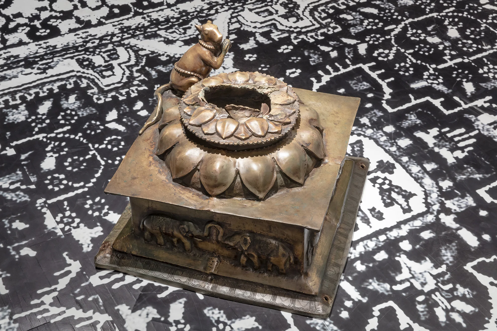 We are obliged to learn life’s inevitable lessons and they are not easy (lies are necessary when the truth is too difficult to believe) , 2016, brass base to stolen Ganesh, installation view at the Art Museum at the University of Toronto as part of the 2017 Sobey Art Award exhibition
