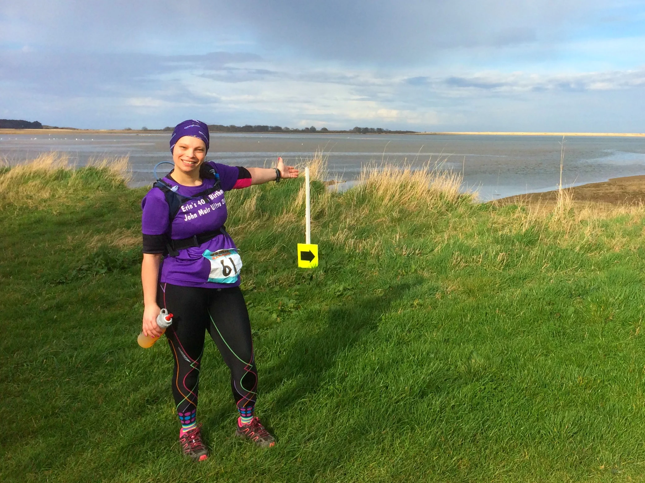 Erin full of smiles at the stunning view and the home straight