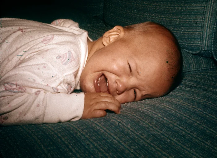 Me, baby, crying, on couch_adj01-sm.jpg