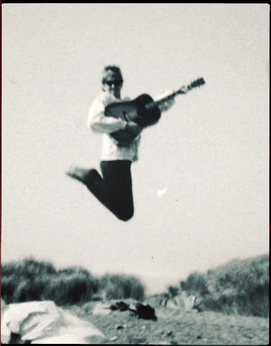 SE-beach-Michael & Deborah-guitar-jumping_adj01b-sm.jpg