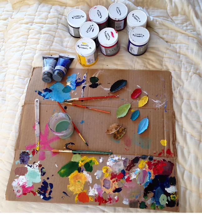 Paints & brushes on cardboard_adj01-sm.jpg