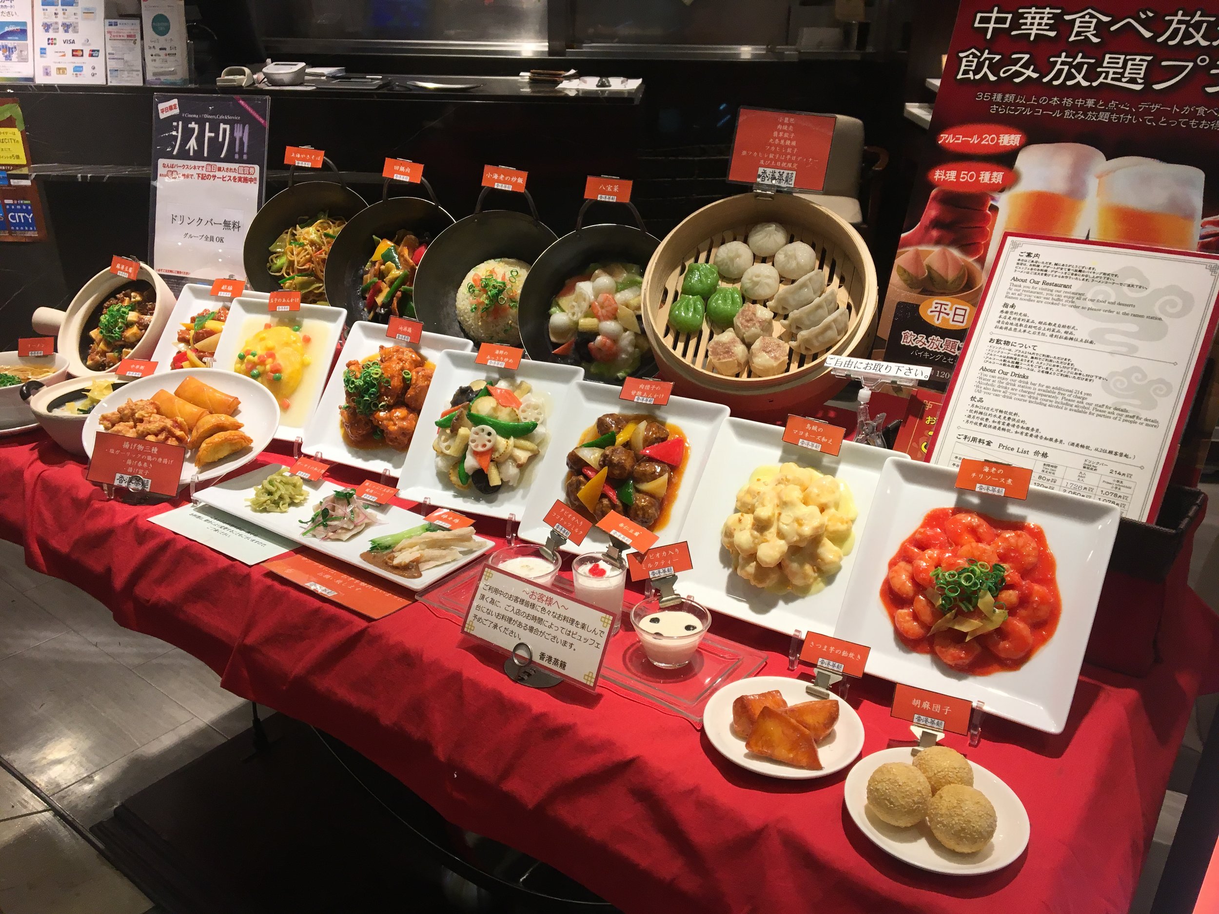 Plastic Japanese food out front of a store. You would for sure get sick if you ate this food.