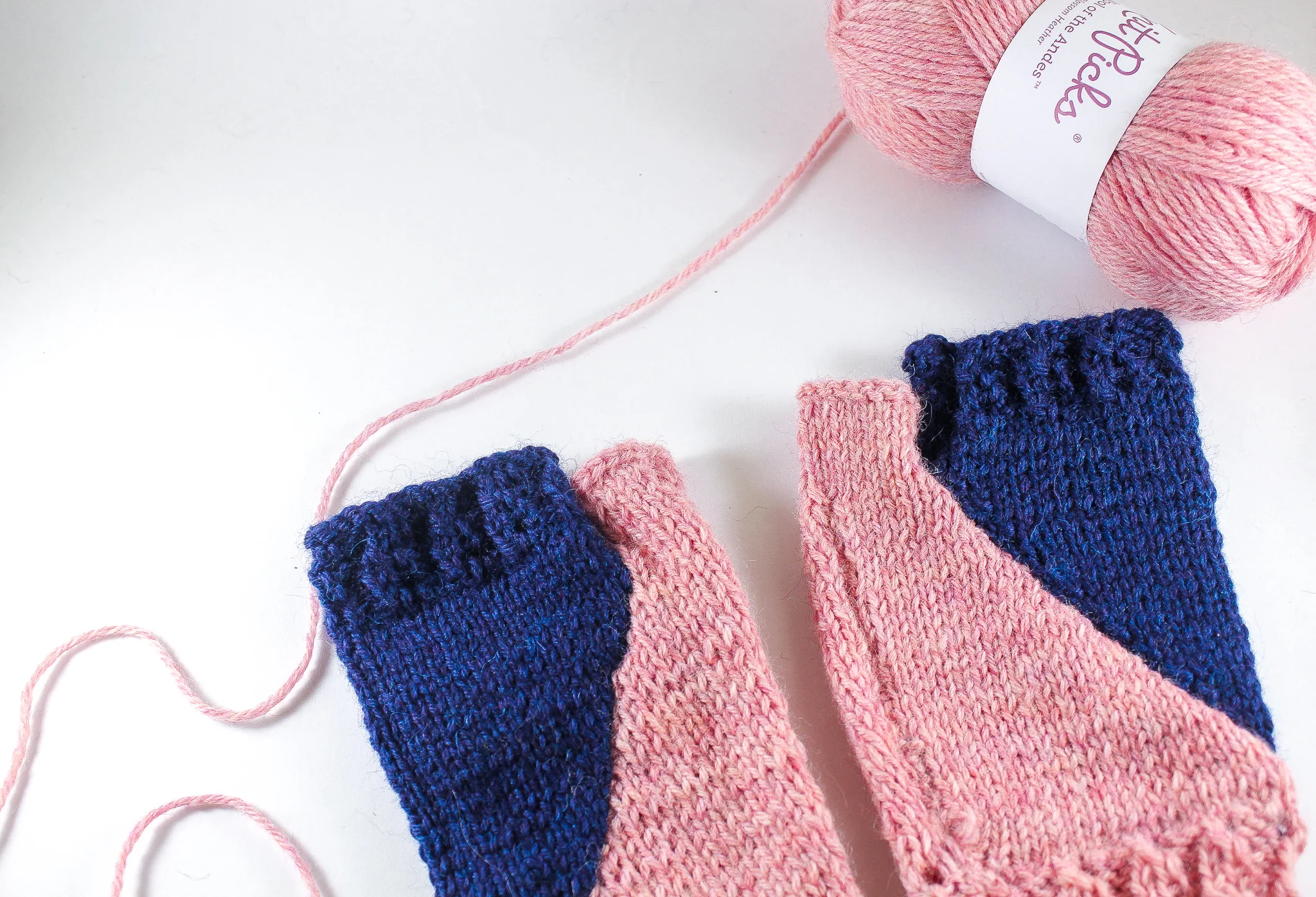 Handmade knit fingerless gloves in diagonal pattern - Pink and Navy by Bahra