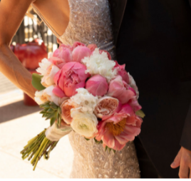 Bride holding a bouquet of pink and white flowers