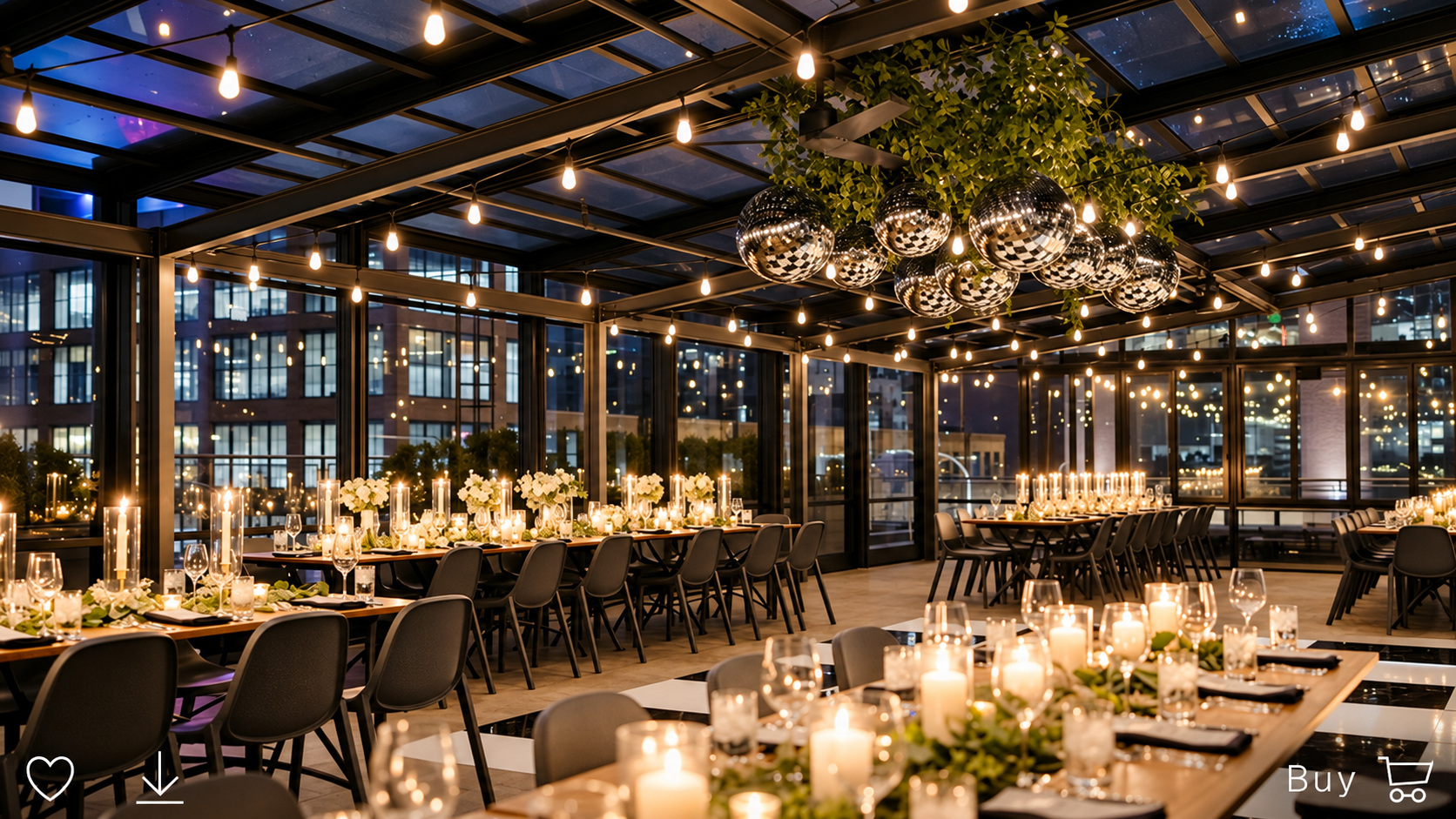 Elegant indoor event space with long tables decorated with candles and floral centerpieces, surrounded by black chairs, lit by string lights and disco ball decorations, with large windows showing city lights outside.
